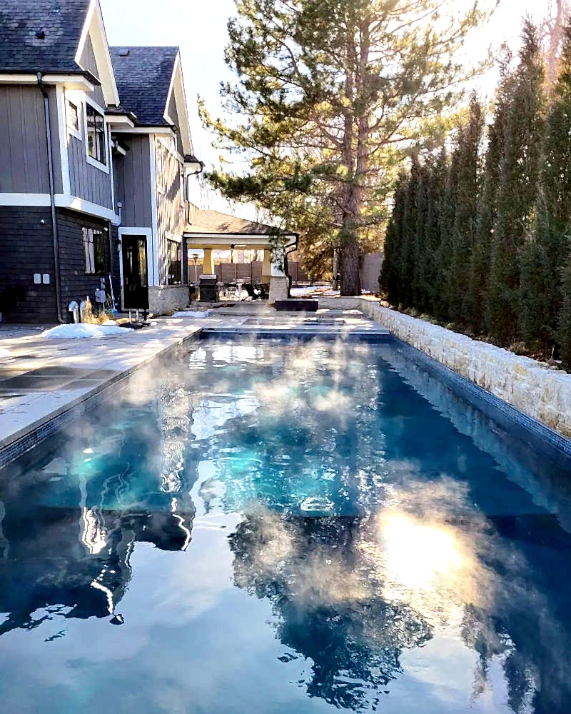 Kid with Broncos hat enjoying pool